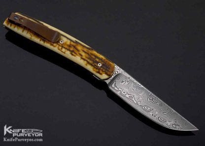 Brad Zinker Custom Knife Mammoth and Damasteel Damascus with Bronze Clip Front Flipper - Image 3