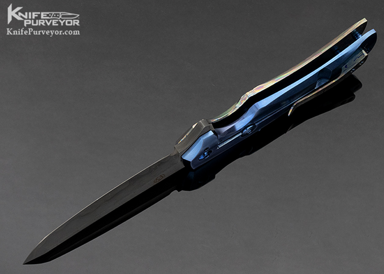 https://www.knifepurveyor.com/wp-content/uploads/2021/05/Mike-Zscherny-Custom-Knife-Damascus-and-Timascus-Frame-Lock-Flipper-10531-Belly.jpg