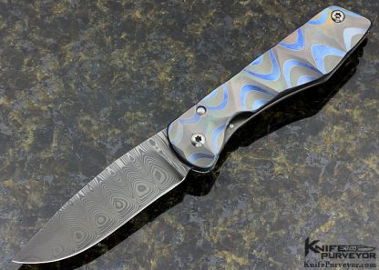 Juergen Schanz Custom Knife Damasteel with Textured Stainless Steel Laminted Titanium Model 2 Drop Point Pocket Knife