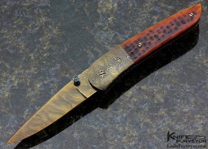 Rick Dunkerley Custom Knife with Blued Sole Authorship Damascus and Jigged Bone Linerlock