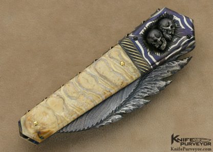 Arthur Whale Custom Knife Blued Carved Damascus with Damascus Bolsters with Silver Skulls and Mammoth Tooth Linerlock - Image 3