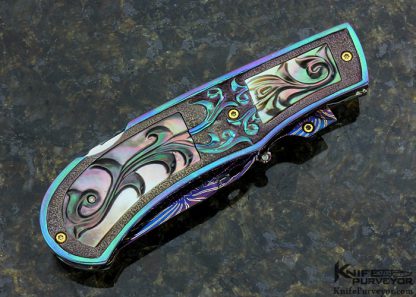 Suchat Jangtanong Custom Knife Carved Anodized Stippled Titanium with Blued Robert Calcinore Mosaic Damascus and Carved Tahitian Blacklip Pearl Lockback - Image 5