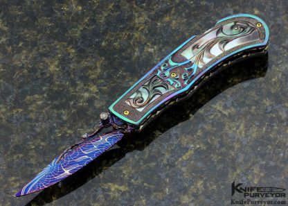 Suchat Jangtanong Custom Knife Carved Anodized Stippled Titanium with Blued Robert Calcinore Mosaic Damascus and Carved Tahitian Blacklip Pearl Lockback