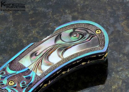 Suchat Jangtanong Custom Knife Carved Anodized Stippled Titanium with Blued Robert Calcinore Mosaic Damascus and Carved Tahitian Blacklip Pearl Lockback - Image 4