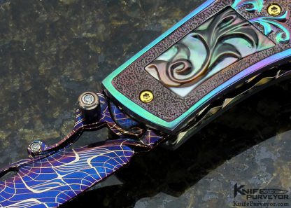 Suchat Jangtanong Custom Knife Carved Anodized Stippled Titanium with Blued Robert Calcinore Mosaic Damascus and Carved Tahitian Blacklip Pearl Lockback - Image 3