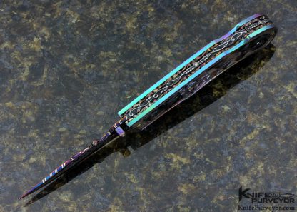 Suchat Jangtanong Custom Knife Carved Anodized Stippled Titanium with Blued Robert Calcinore Mosaic Damascus and Carved Tahitian Blacklip Pearl Lockback - Image 2